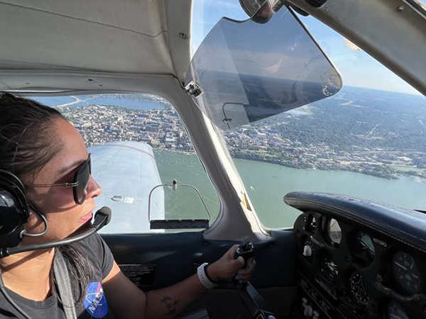Mayra Oyola piloting an airplane