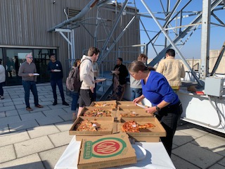 Picture of rooftop pizza lunch at the Alumni Open House